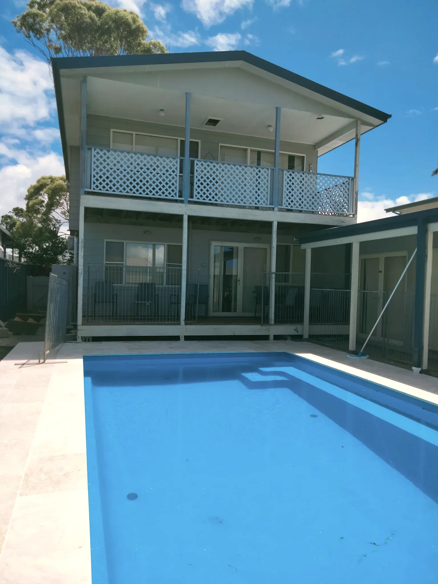 Greenwell — The pool leading to the covered verandah