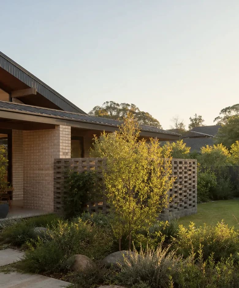 Concept visualisation — a courtyard elevation with brick screening and established planting