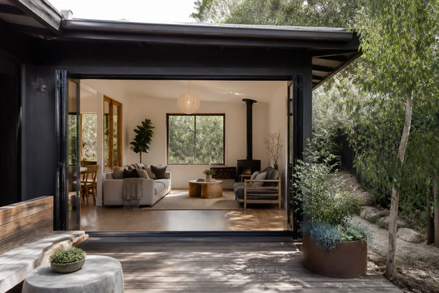 Threshold connecting an existing home to a light-filled rear extension