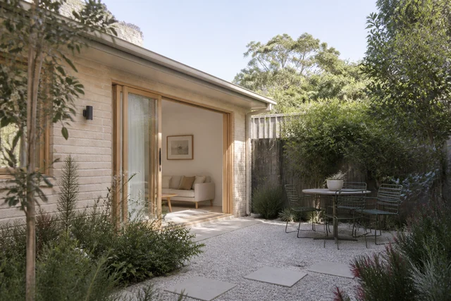 Compact dwelling opening to a private planted courtyard